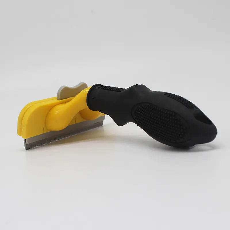 Yellow and black pet grooming deshedding tool with ergonomic handle for dogs and cats