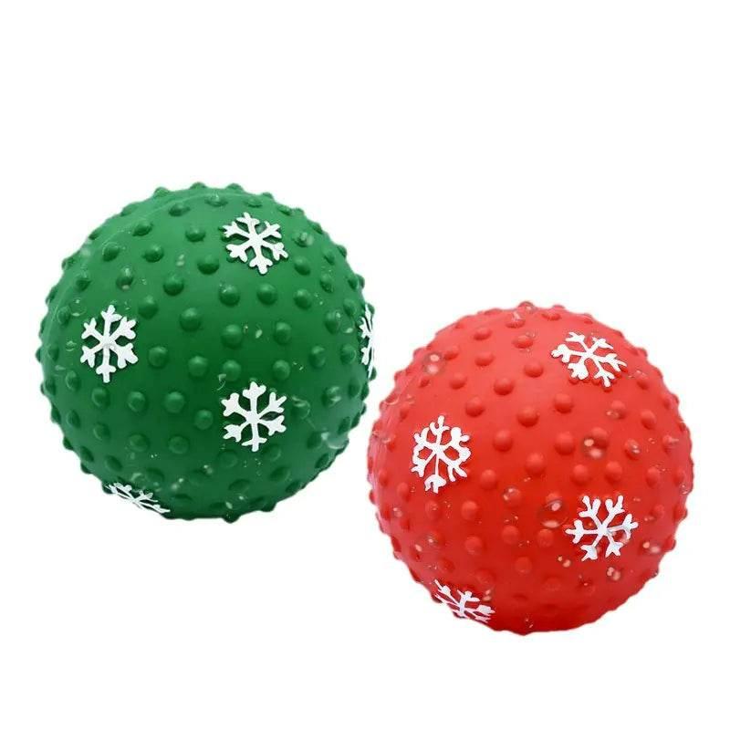 Red and green Christmas-themed pet chew balls with snowflake designs