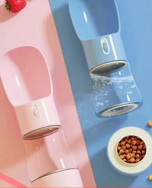 Pink and blue pet water dispensers with automatic flow, ideal for dogs and cats, shown with dry food and strawberry.