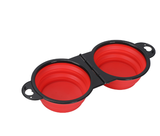 Red collapsible dual pet bowl for dogs and cats, portable travel feeder with black frame
