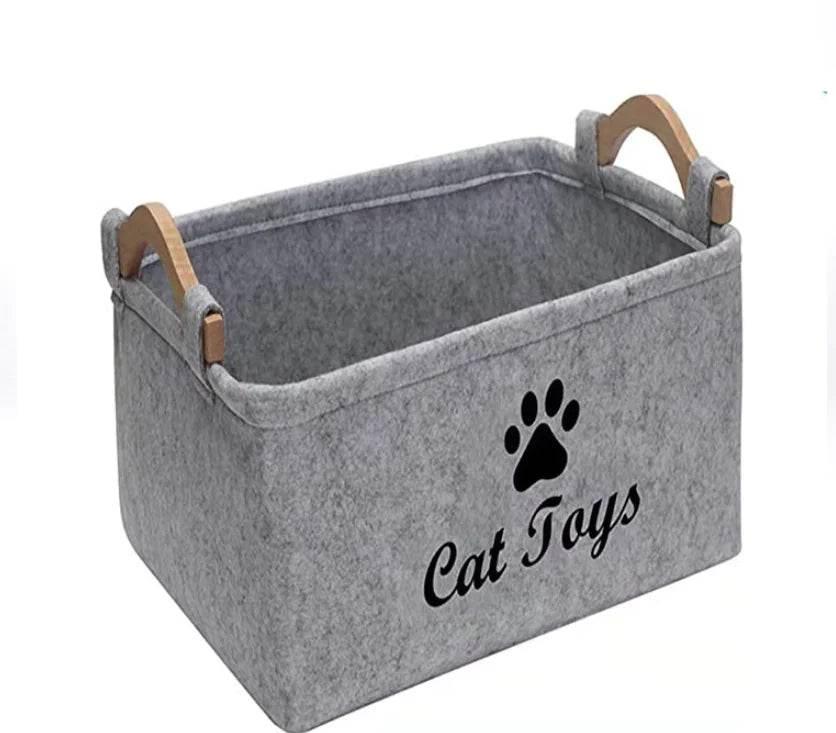 Gray felt cat toy storage bin with wooden handles and paw print design for pet organization