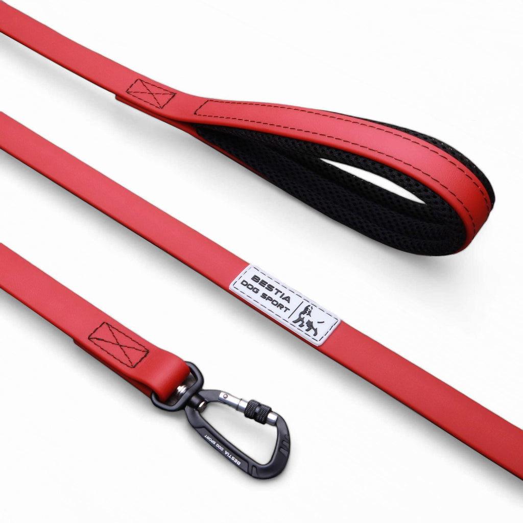 Red dog leash with black mesh handle and carabiner, Bestia Dog Sport branding, pet accessory