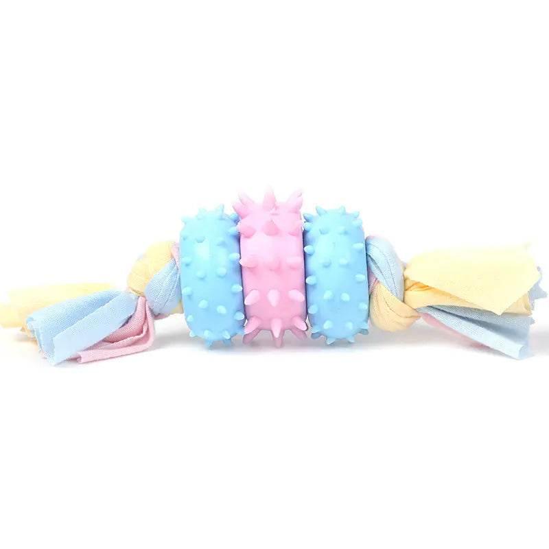 Colorful dog chew toy with rubber spikes and fabric ropes for interactive play and dental care
