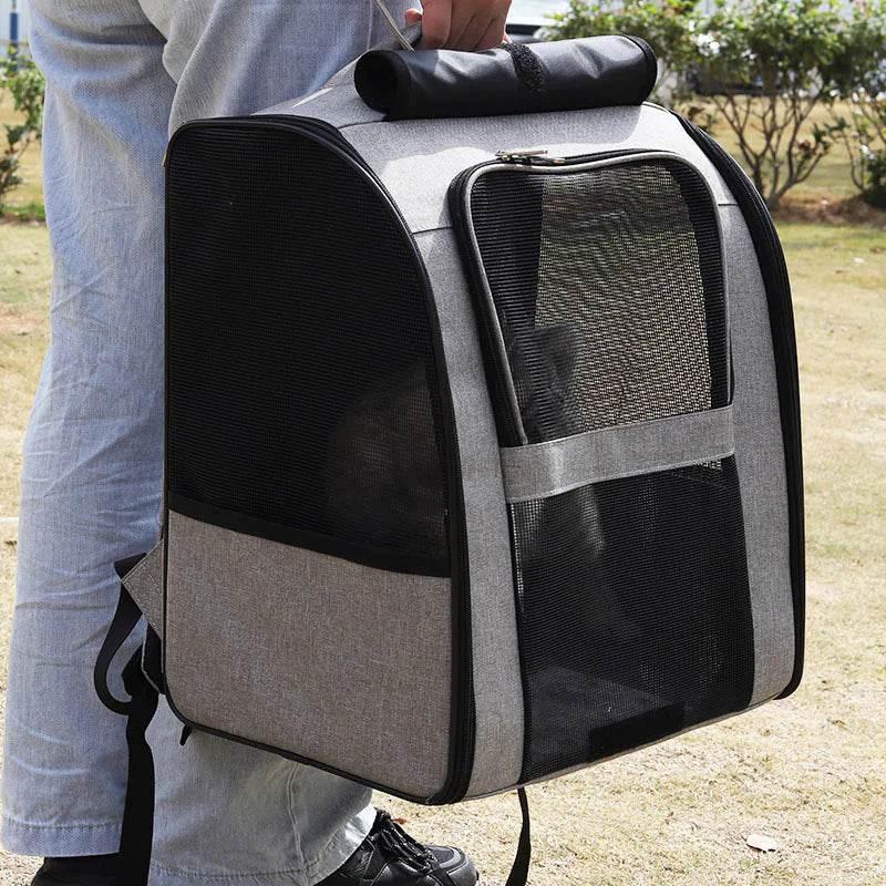 Gray and black mesh pet carrier backpack for dogs or cats, portable and breathable for outdoor use