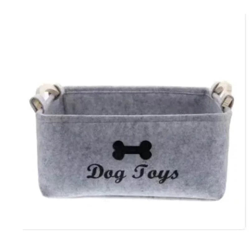 Gray felt dog toy storage bin with bone design and handles, perfect for organizing pet supplies