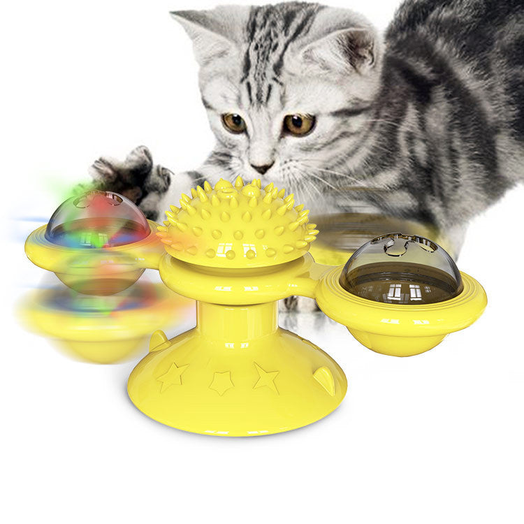 Yellow cat toy with spinning balls and spike center, perfect for interactive play and pet enrichment.