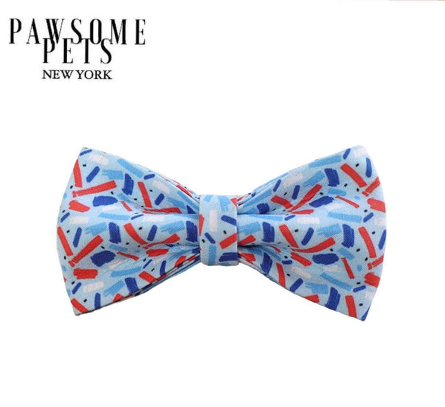 Blue pet bow tie with red and navy abstract pattern, stylish dog accessory for festive occasions