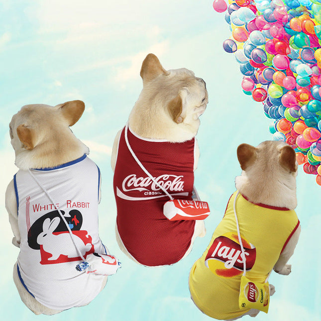 Three French bulldogs in fun branded pet shirts ? White Rabbit, Coca-Cola, and Lay's ? against a sky with colorful balloons.