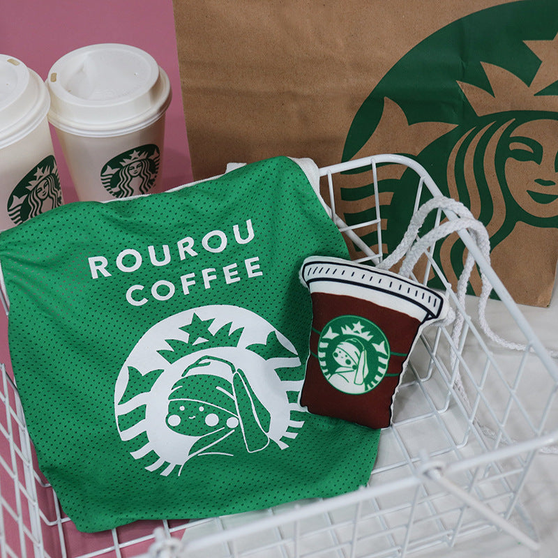 Green Starbucks-themed pet toy and coffee cup plush in shopping basket, pet accessories for dogs and cats
