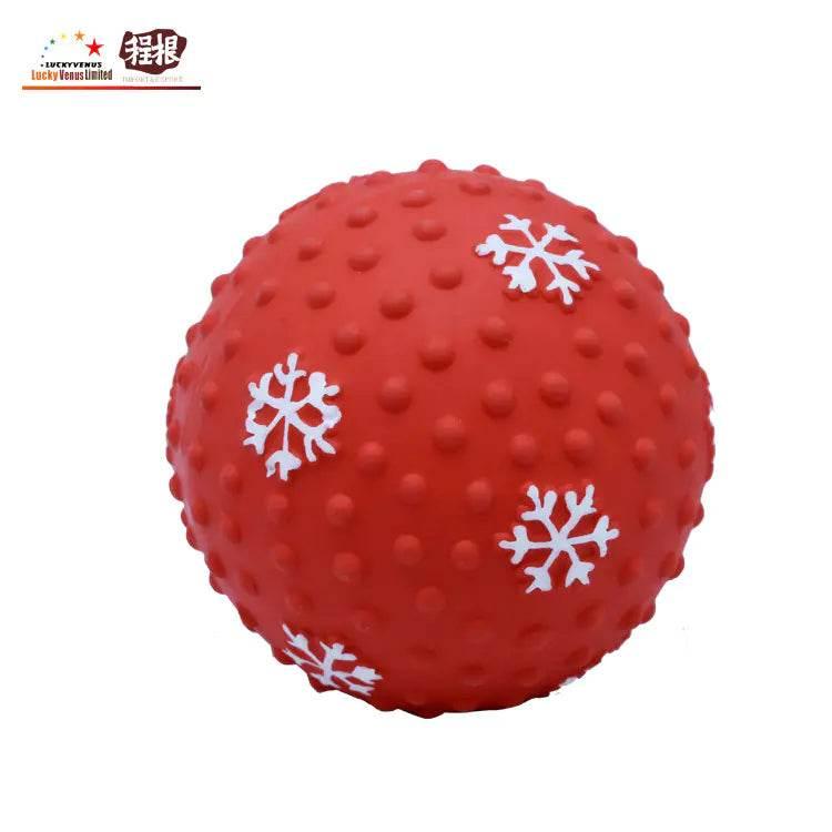 Red textured dog chew toy ball with white snowflake patterns for pets
