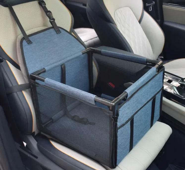 Blue pet car seat carrier with mesh sides, secured in vehicle for safe dog or cat travel