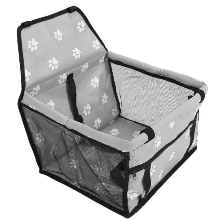 Gray pet carrier with white paw prints, mesh sides, and black trim for dogs or cats
