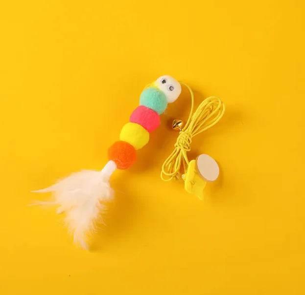 Colorful cat toy with pom-poms, feather, and bell for interactive pet play