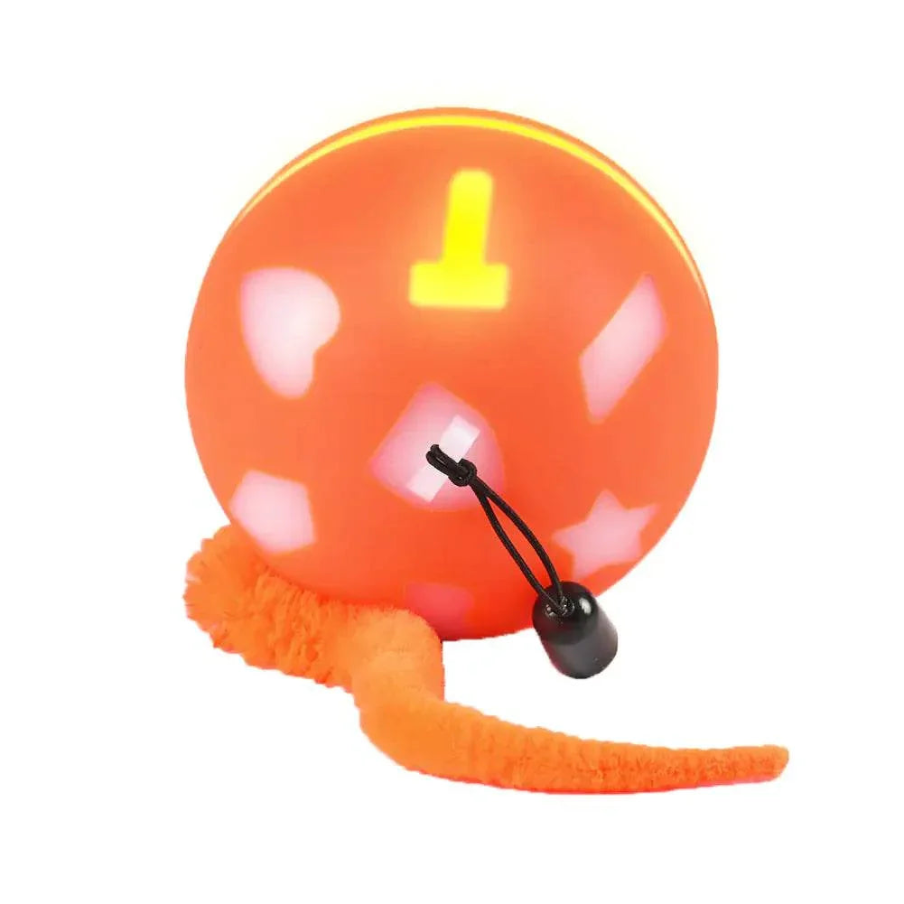 Orange LED pet toy ball with fluffy tail and bell for cats and dogs
