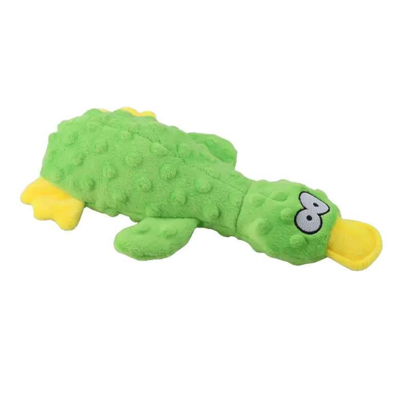 Green plush duck dog toy with yellow beak and feet, textured surface for chewing