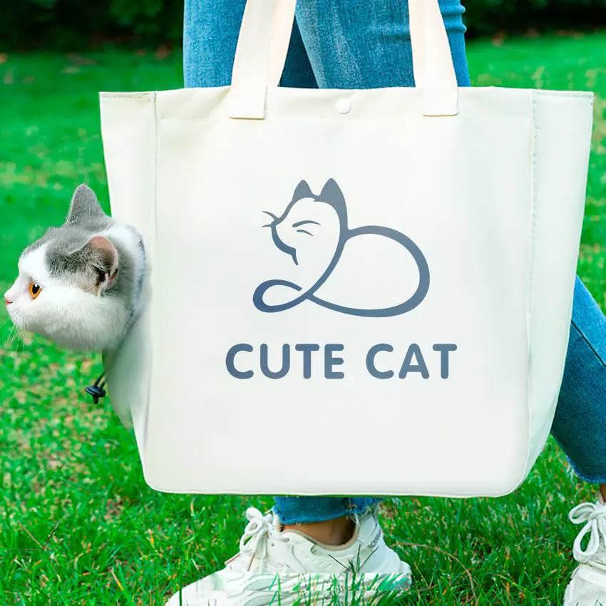 Cute cat peeking from white tote bag with 'Cute Cat' print, perfect for pet lovers and outdoor walks.