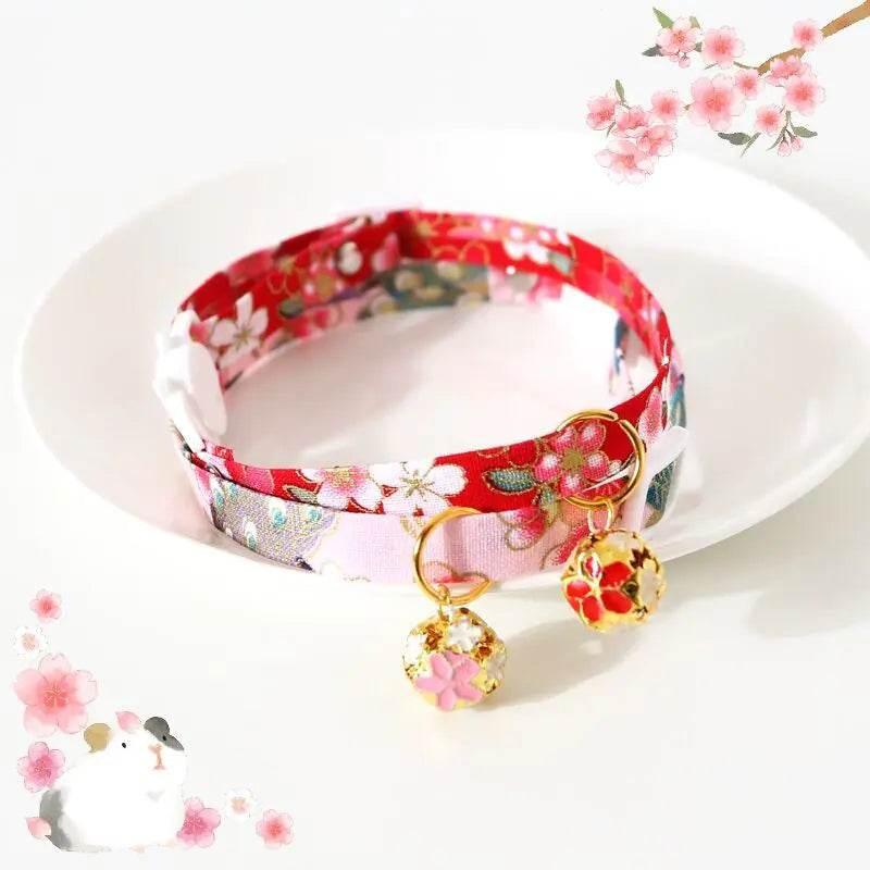 Cherry blossom print cat collar with gold flower charms, perfect for pet accessories and care