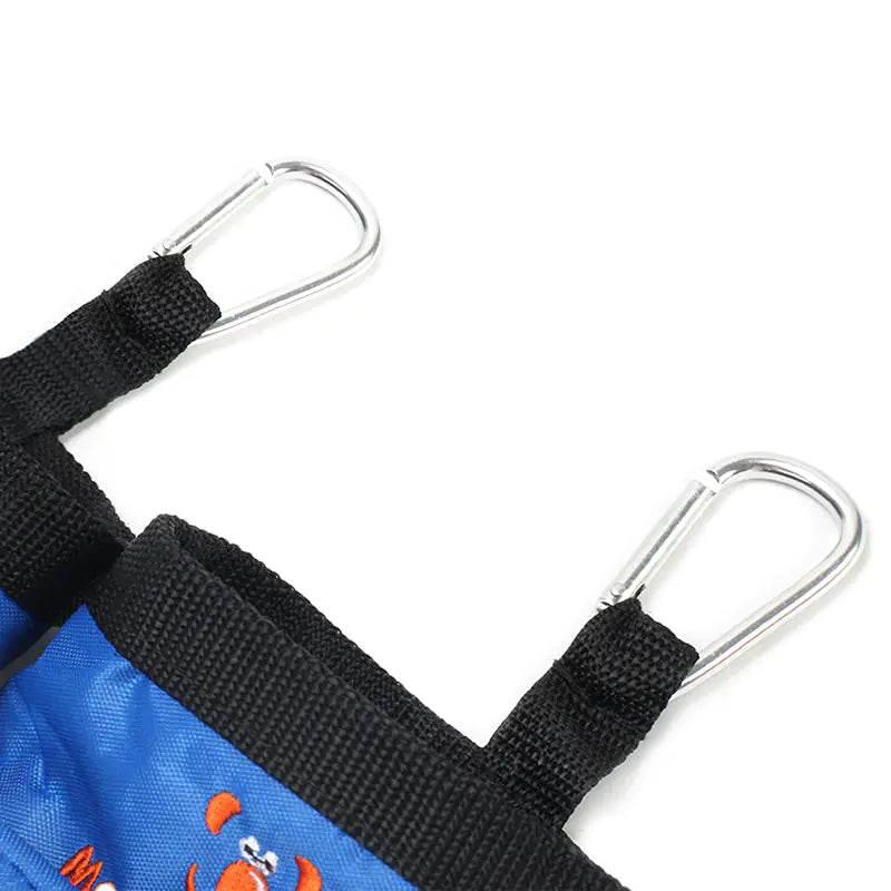 Blue pet carrier with black straps and metal carabiners for secure attachment