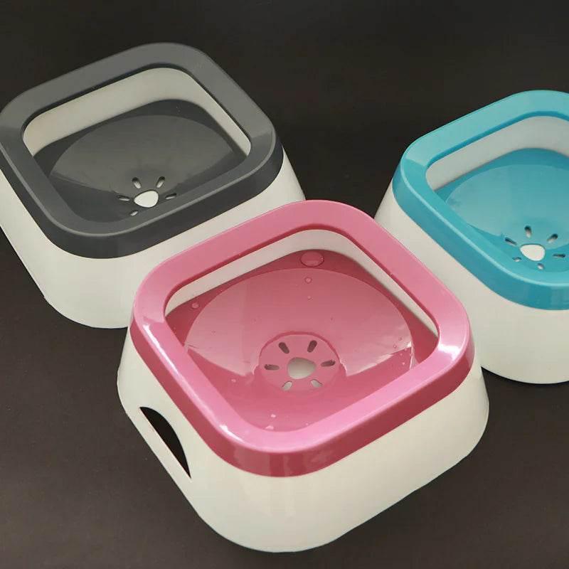Pink, gray, and blue pet water dispensers with slow-flow design for cats and dogs