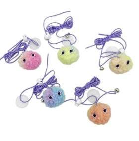 Colorful pom-pom cat toys with bells and strings for playful feline fun and enrichment