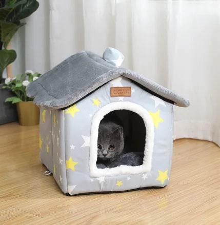 Cozy gray cat house with yellow stars, perfect for indoor cats and pet comfort.