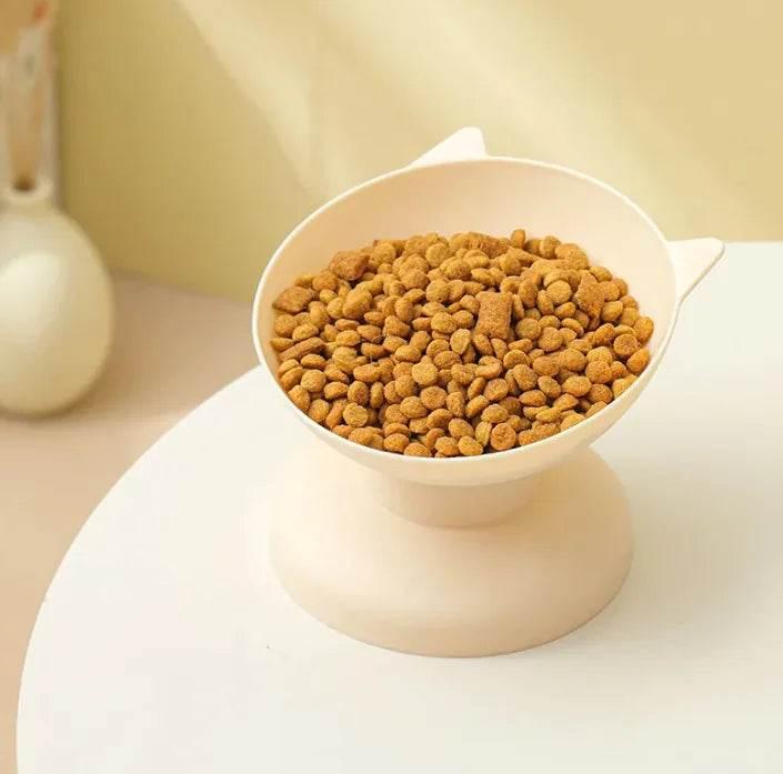 Cat-shaped elevated pet bowl filled with dry kibble for cats or small dogs