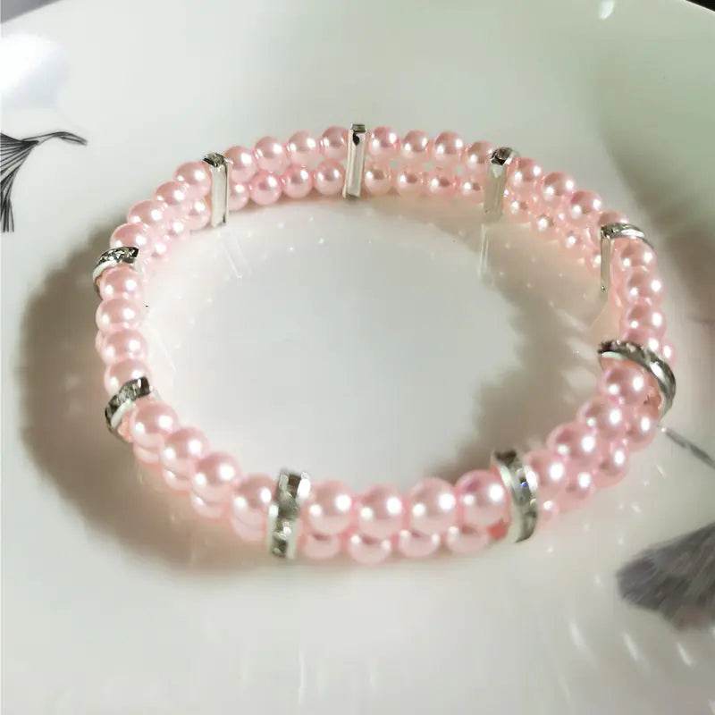 Pink pearl pet collar with silver accents, elegant accessory for dogs and cats
