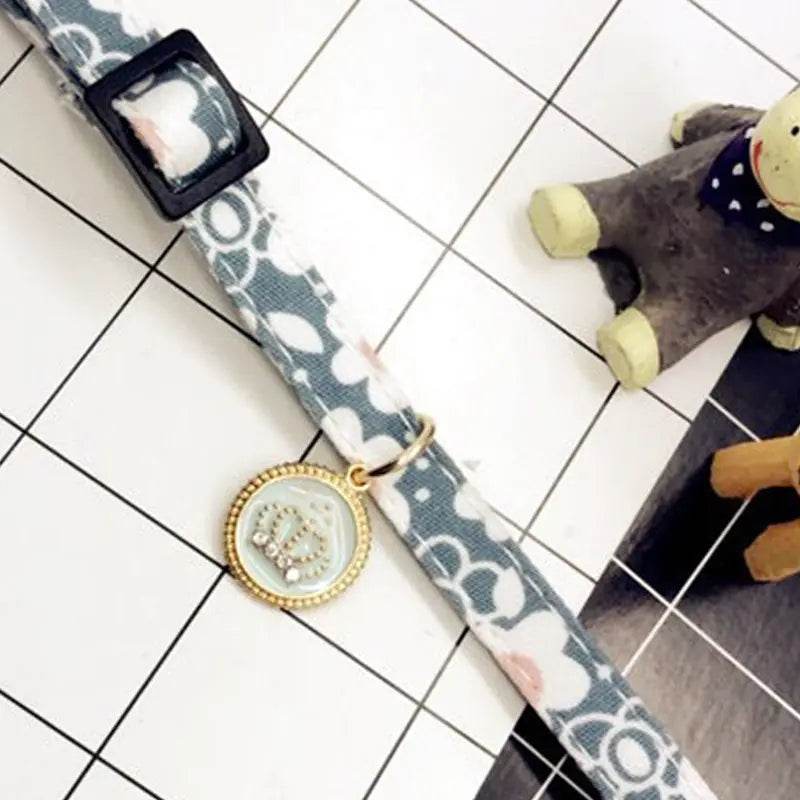 Stylish dog collar with floral pattern and decorative pendant, ideal pet accessory for dogs