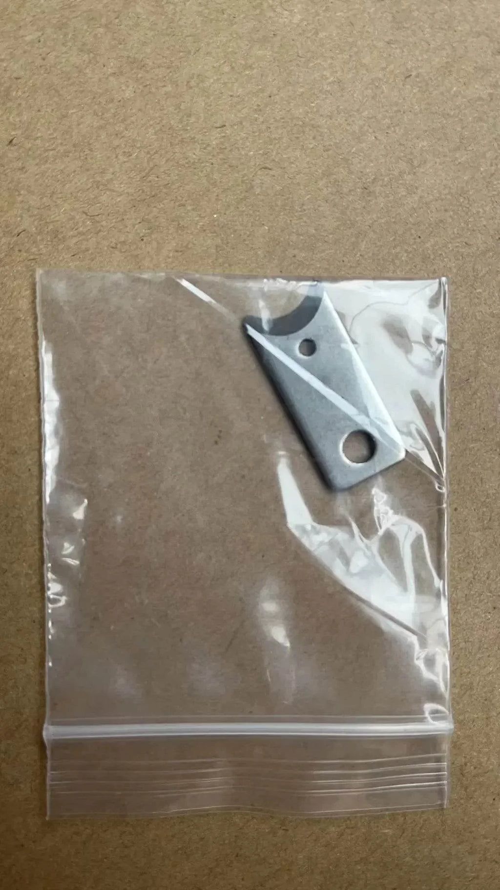 Metal pet accessory replacement part in clear plastic bag for dog or cat gear