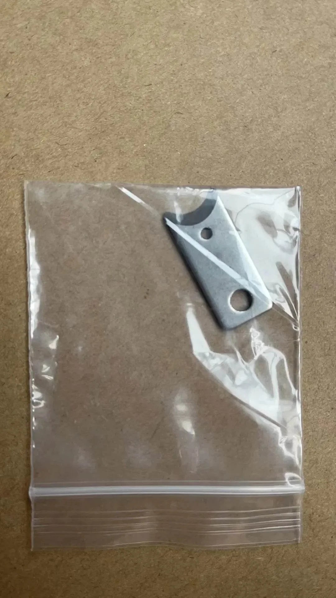 Metal pet accessory replacement part in clear plastic bag for dog or cat gear
