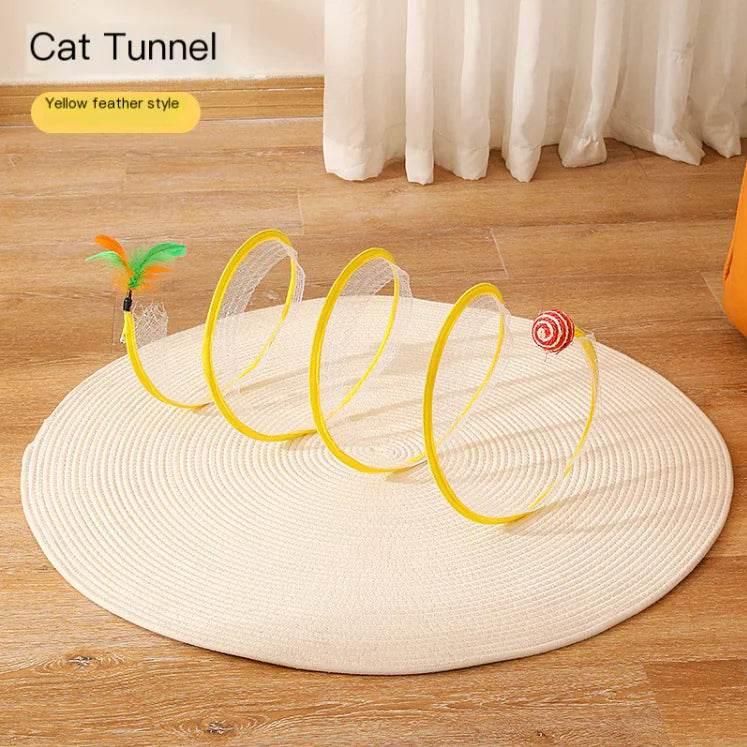 Yellow feather-style cat tunnel toy on woven mat, perfect for indoor feline play and exercise