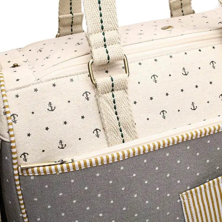 Nautical pet travel bag with anchor print, canvas material, and striped trim for dog or cat essentials