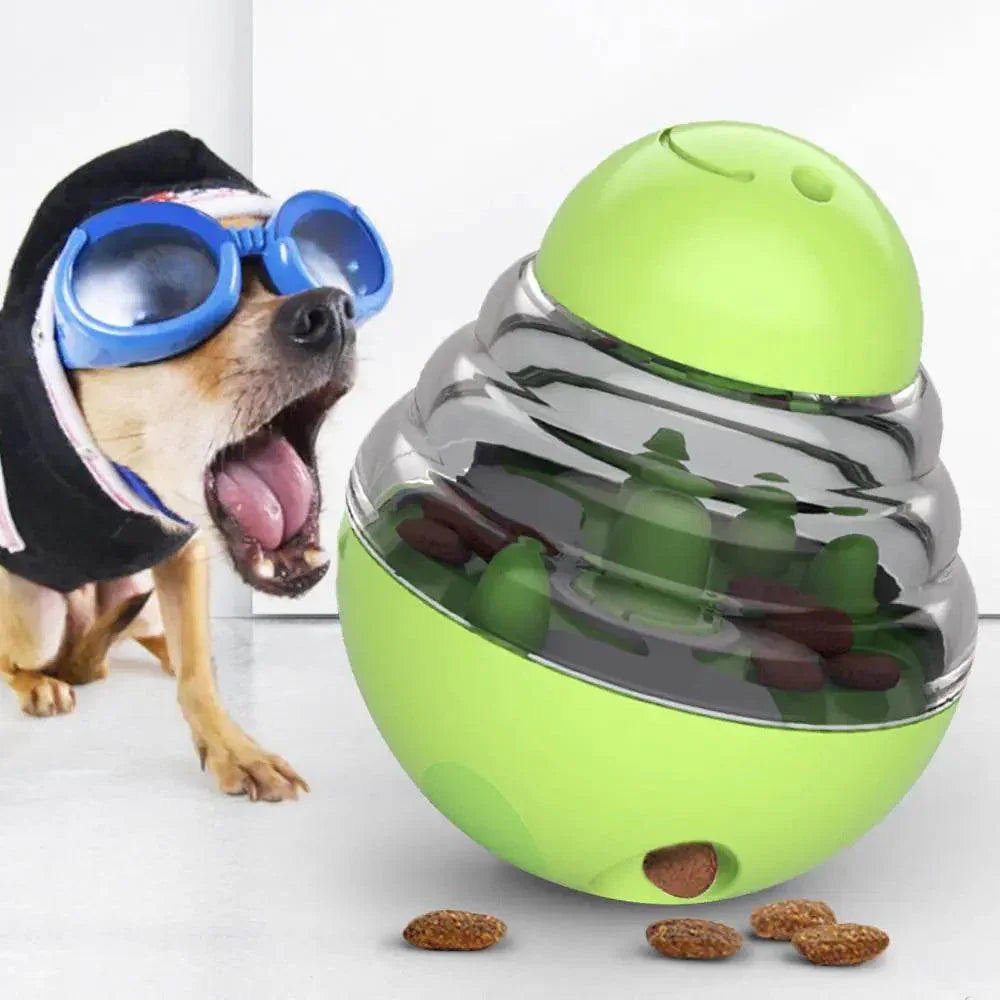 Excited dog in goggles next to green interactive treat puzzle toy for dogs