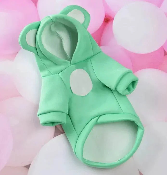 Mint green pet hoodie with bear ears and white dot, soft dog or cat sweater on pink and white balloons