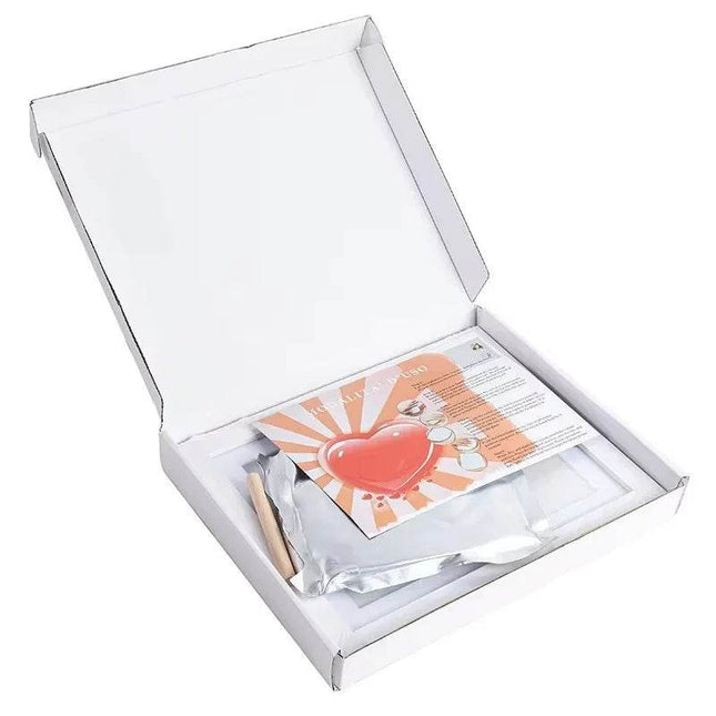 Pet memorial kit with heart design, keepsake items, and instructions in white box for dog or cat loss