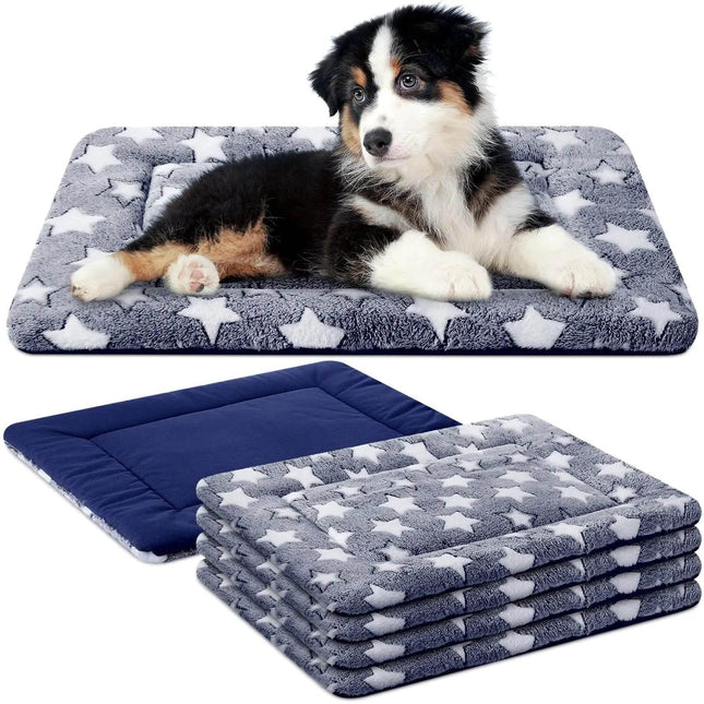 Cute puppy on gray star-patterned dog bed with navy underside, soft pet mat for dogs and cats