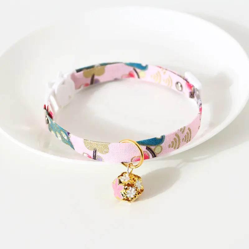 Pink floral cat collar with gold bell charm, pet accessory for cats
