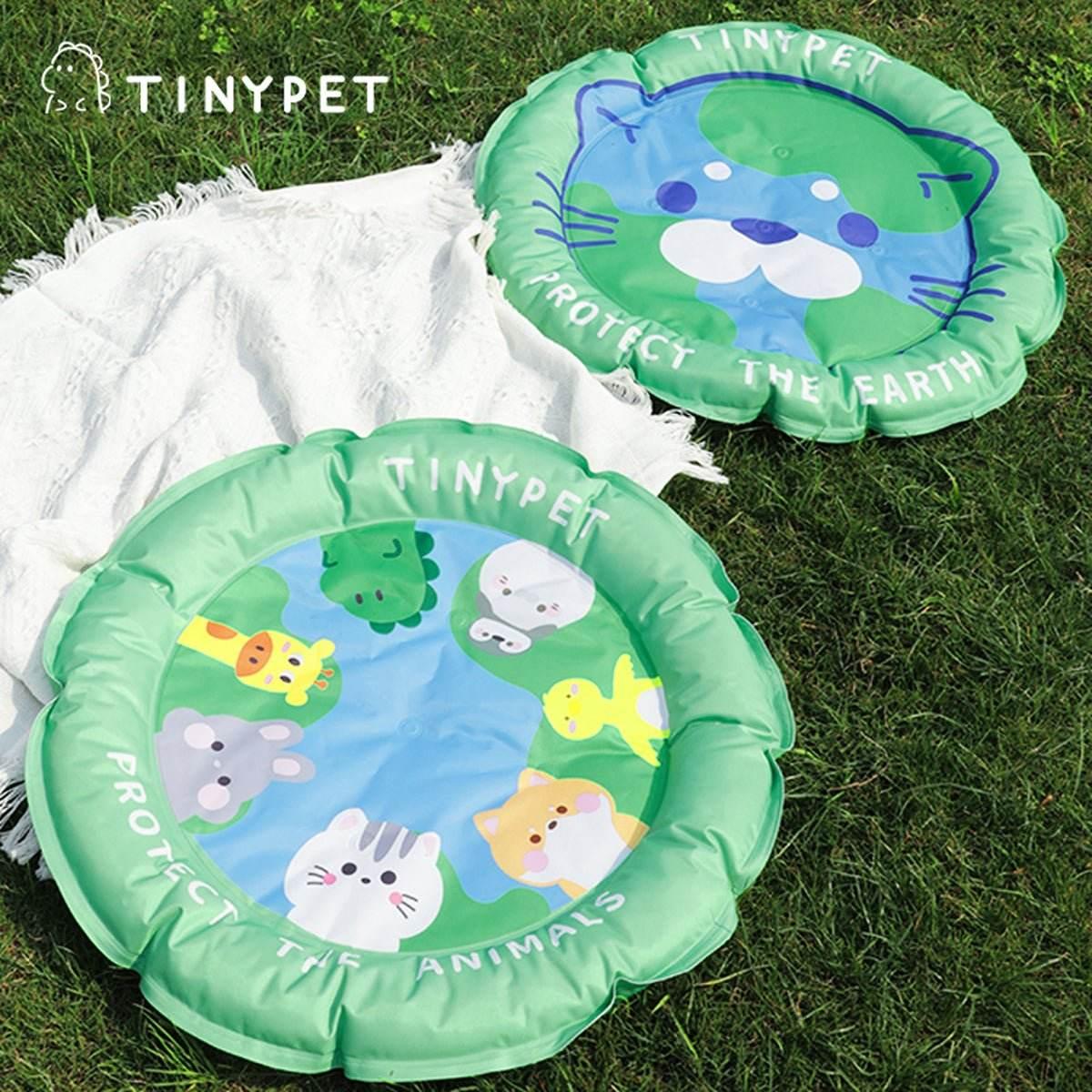 Inflatable pet cooling mats with cute animal designs, perfect for outdoor use on grass.