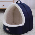 Cozy navy blue pet cave bed with soft white fleece lining, perfect for dogs and cats